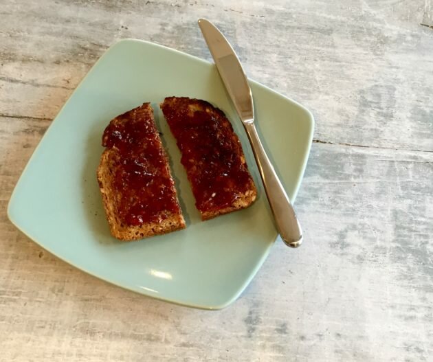 Toast with jam on, cut vertically