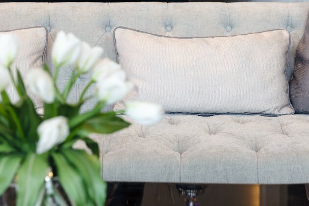 Sofa with pillows and flower, Interior Decoration